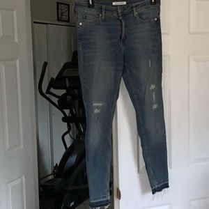 Distressed CK skinny jeans. Vintage denim wash.